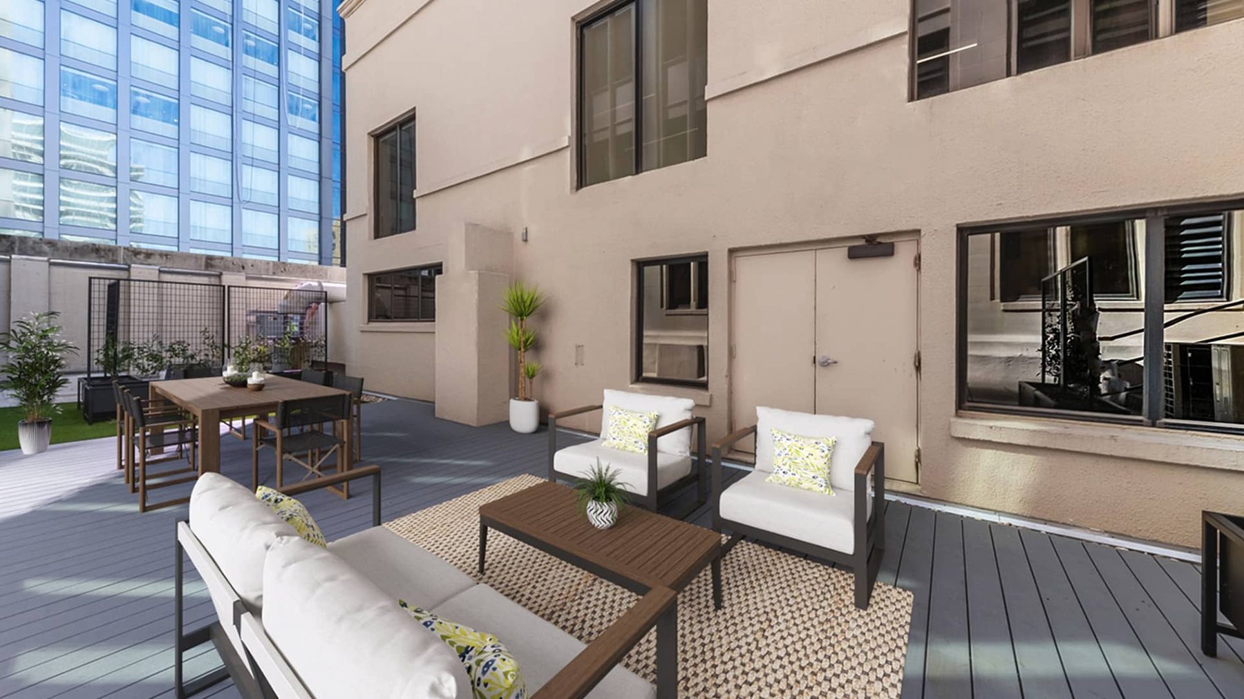Private rooftop patio off the fifth floor, furnished with lounge seating