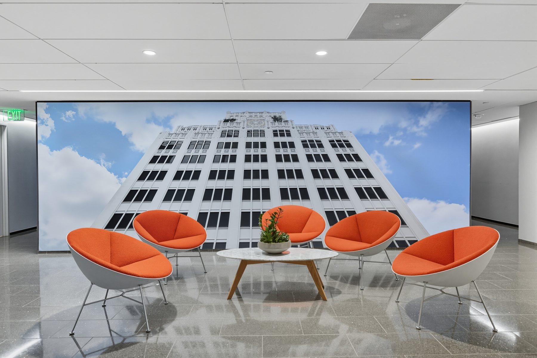 Tenant lounge with lounge seating and a Norwood Tower mural